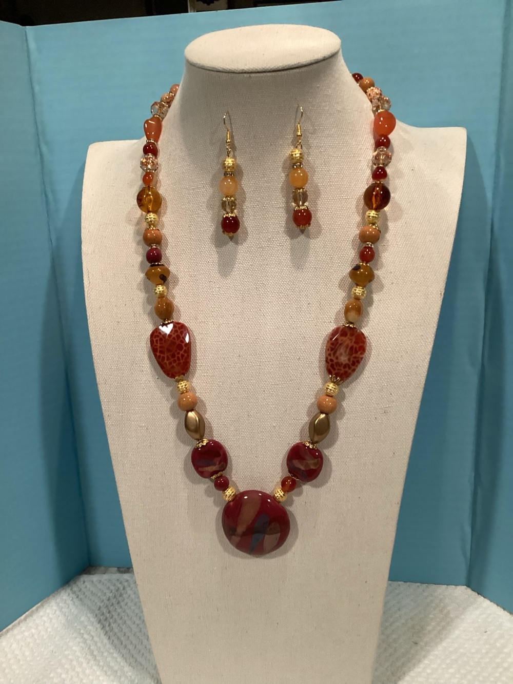 Artisan handcrafted natural stone necklace with matching earrings.